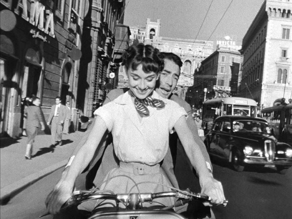 1200px Audrey Hepburn and Gregory Peck on Vespa in Roman Holiday trailer scaled